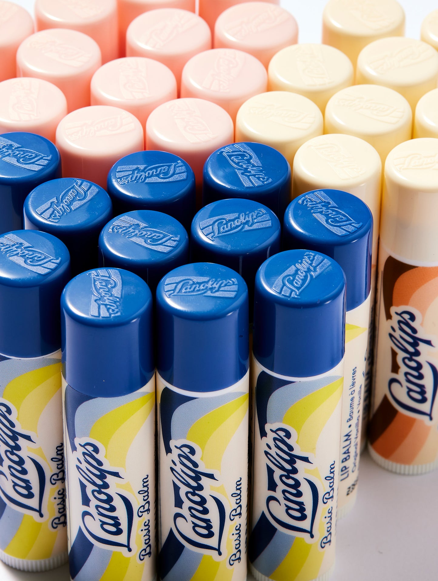 Collection of Lanolips Basic Balms in the natural flavours of Original Vanilla, Coconutter and Strawberry.