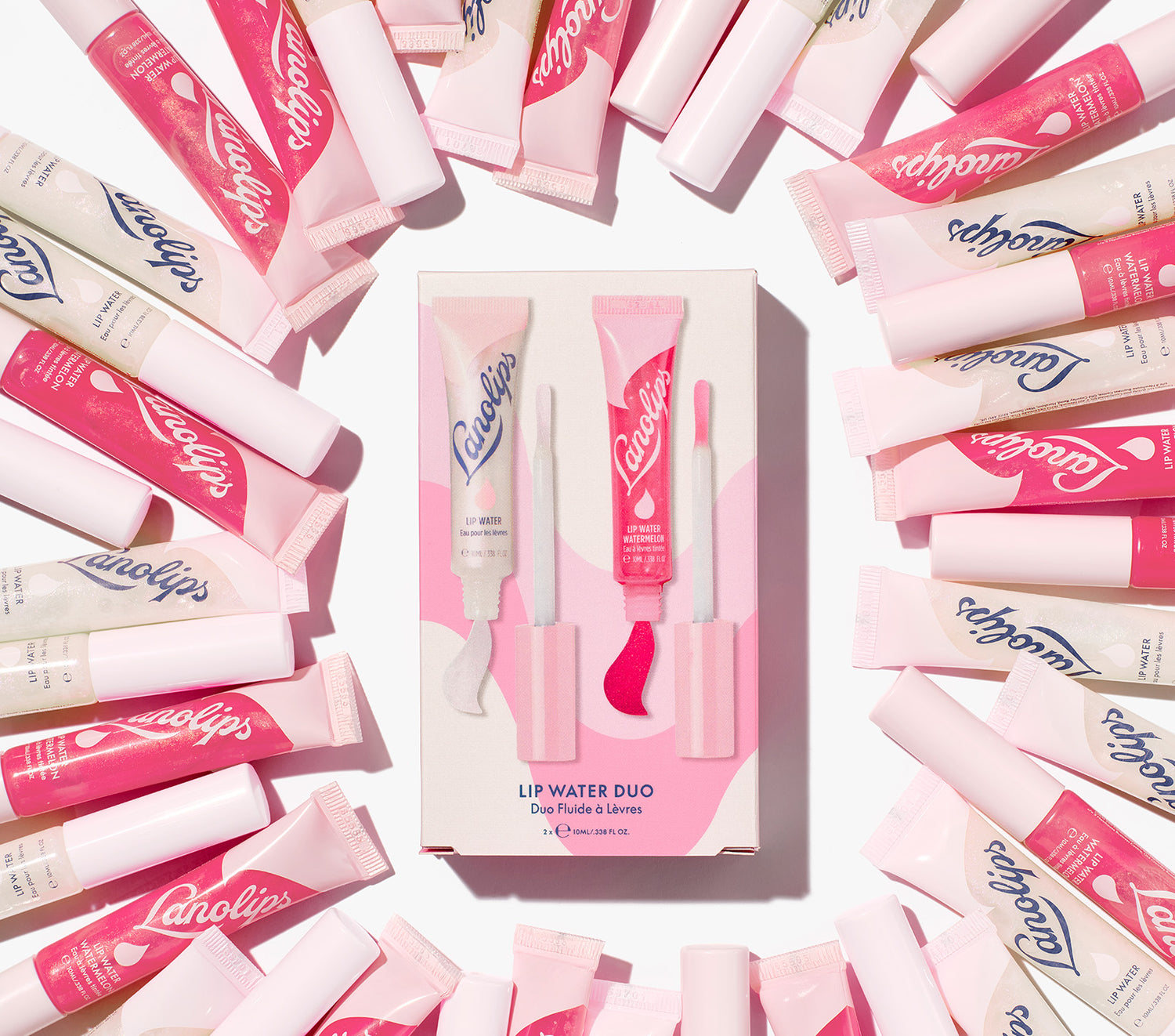 A still shot of the Lanolips Lanolin Lip Water Duo box with tubes of Liquid Lanolin Lip Water and Lip Water Watermelon around the packaging. Made with liquid lanolin, hyaluronic acid, natural flavours and holographic sparkles to make your lips super glowy.