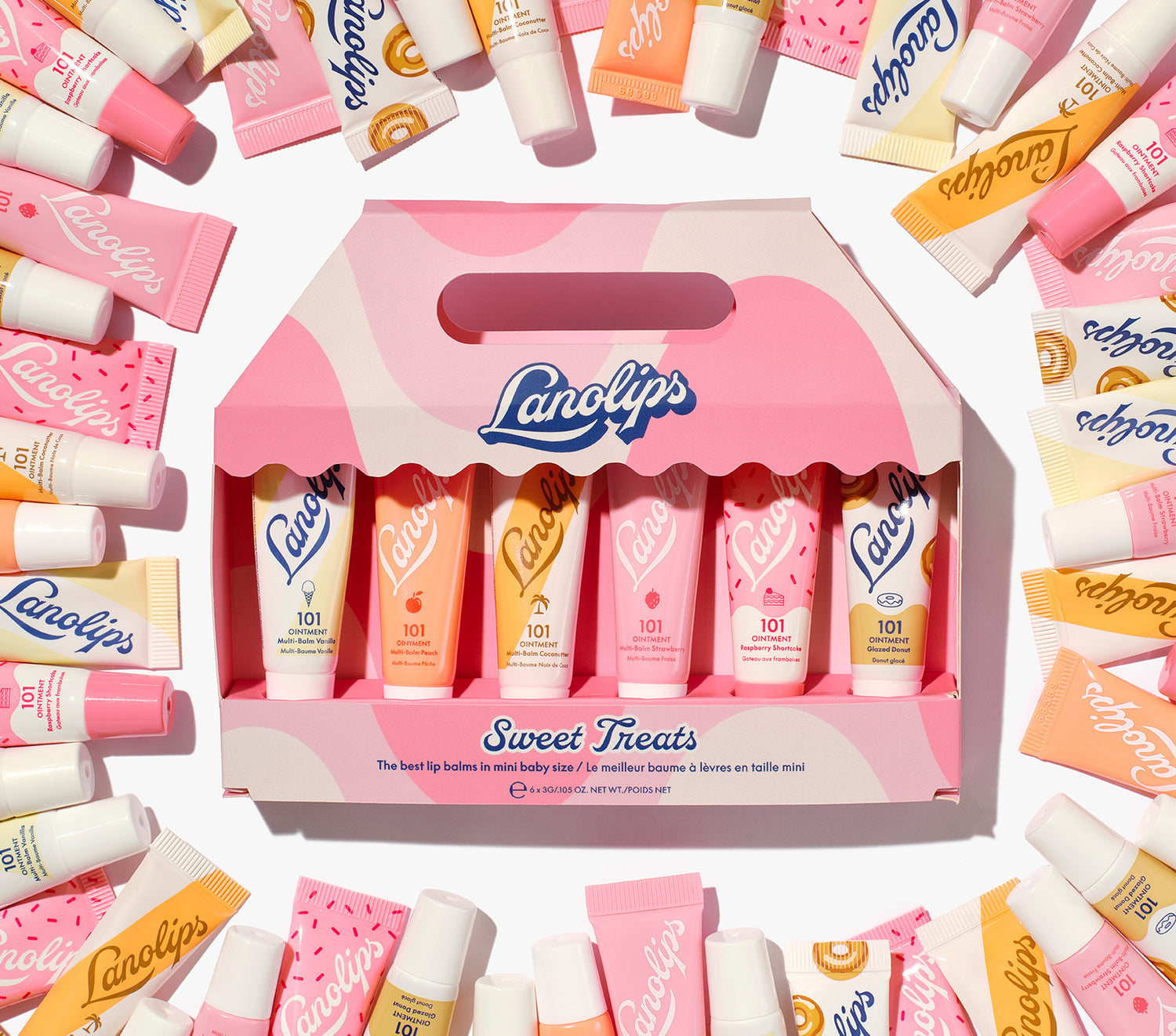 Lanolips Sweet Treats gift set – 6 pc mini 101 Ointment balms in assorted flavours, packed in a pink carry box surrounded by colourful Lanolips tubes. Made with rich lanolin, vitamin e and natural flavours.