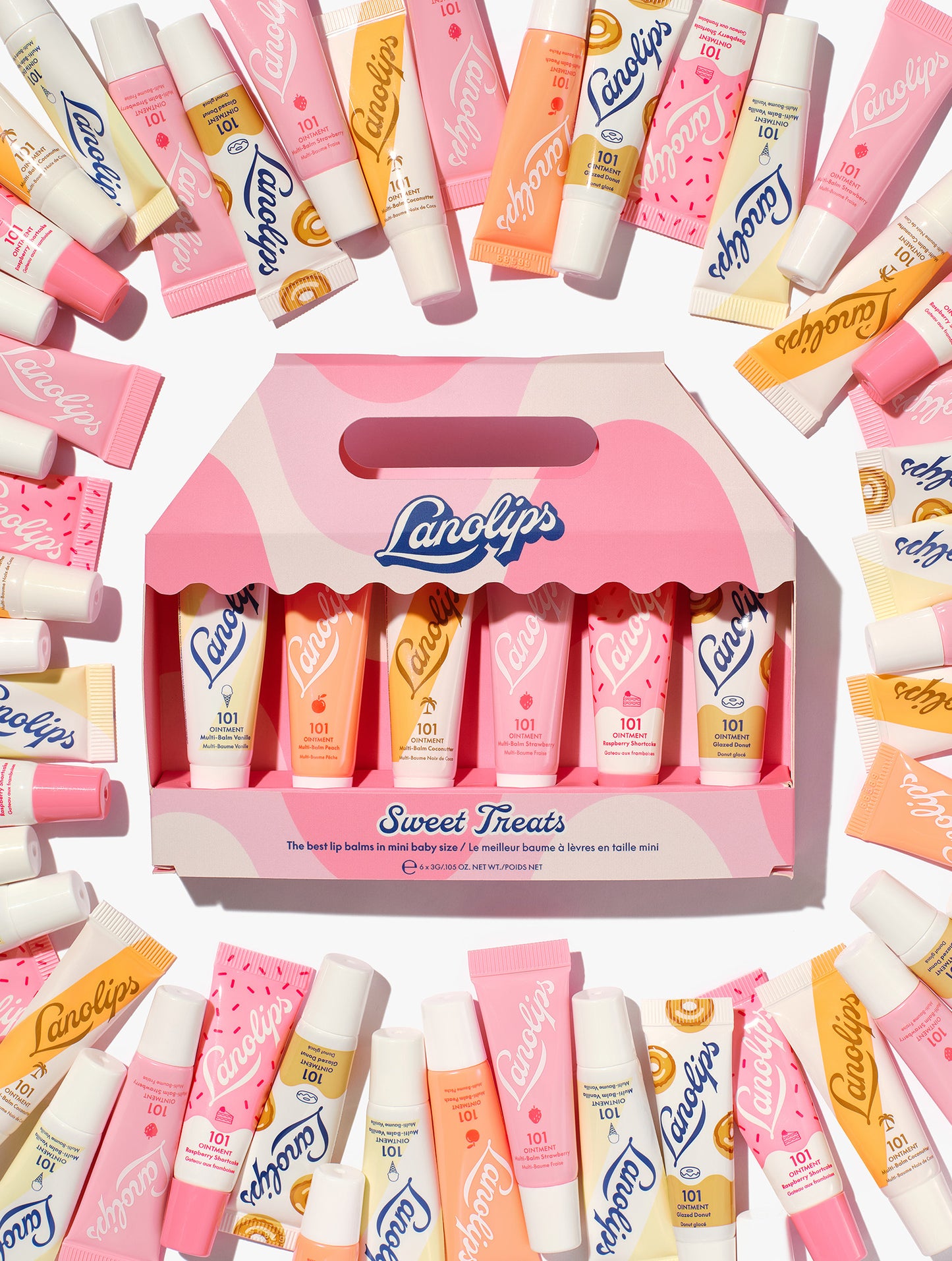 Lanolips Sweet Treats gift set – 6 pc mini 101 Ointment balms in assorted flavours, packed in a pink carry box surrounded by colourful Lanolips tubes.