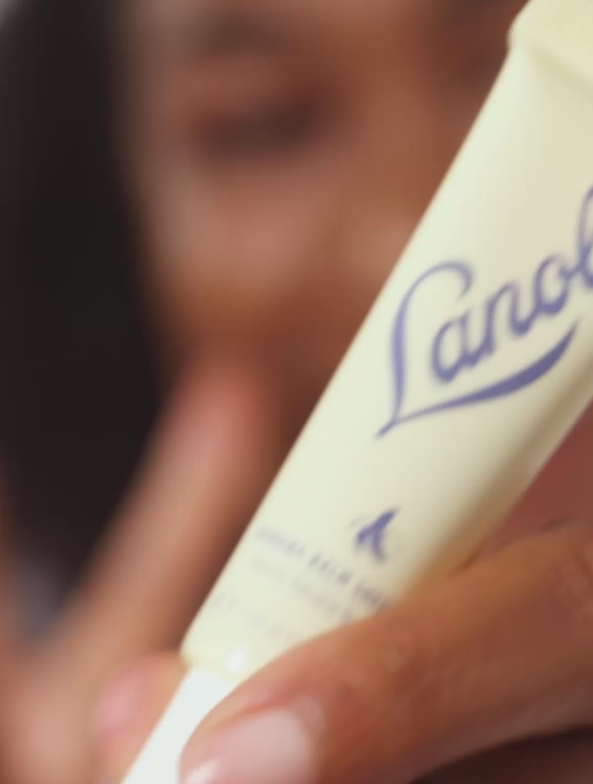 Video of model applying Lanolips Banana Balm Lip Sheen 3-in-1. Made with all-natural lanolin, banana extract, cocoa seed butter and sheen, it gives you soft, hydrated, glowing lips.