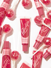 Load image into Gallery viewer, Lanolips&#39; Glossy Balm Candy a fruity pink tint with added gold flecks for the ultimate glossy tint  
