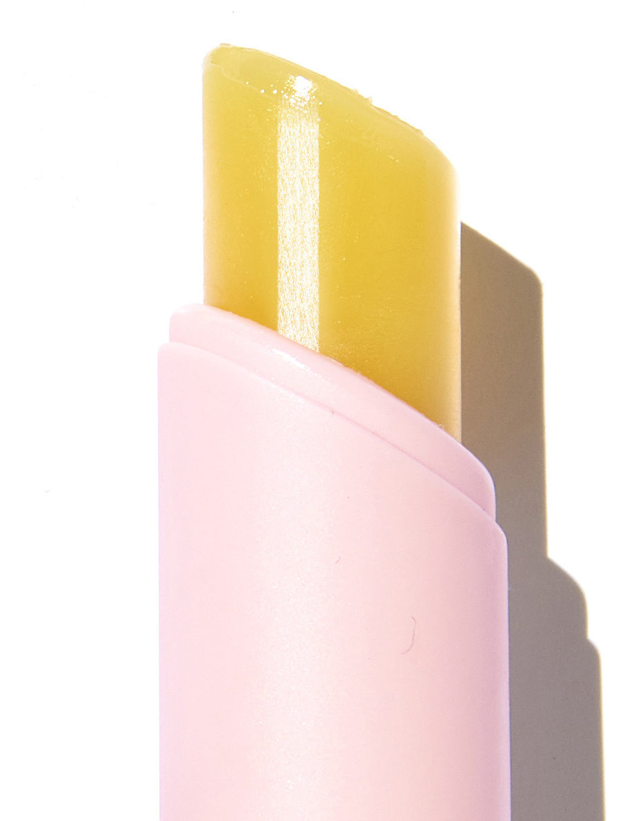 Lanolips the original lanostick packaging with lid off showing the product texture.