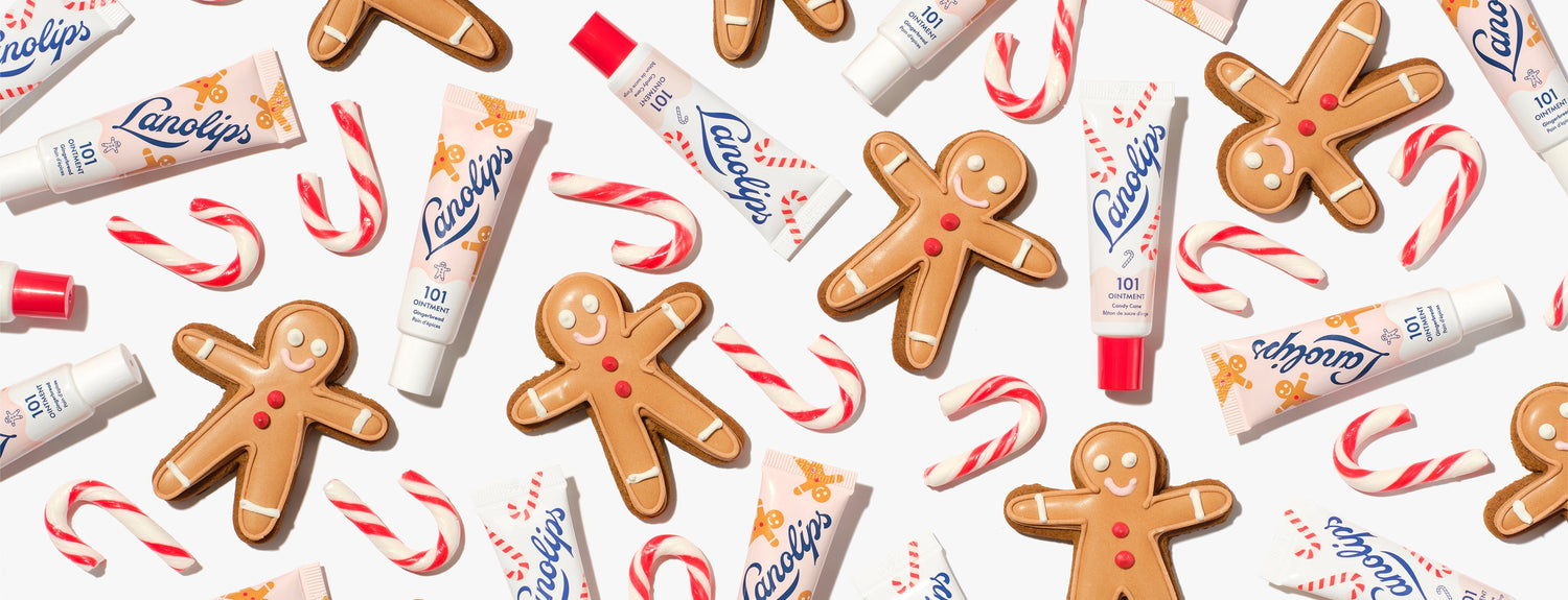 Flatlay of the limited edition Lanolips 101 Delicious Holiday range, including two new festive flavours - gingerbread and candy cane. Made with hydrating lanolin, vitamin E and all-natural sweet flavours - it's the sweetest swipe for your lips.