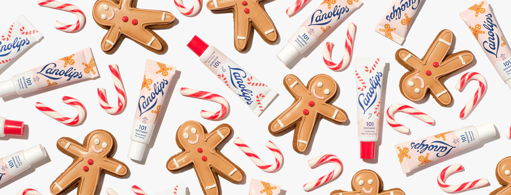 Flatlay of the limited edition Lanolips 101 Delicious Holiday range, including two new festive flavours - gingerbread and candy cane. Made with hydrating lanolin, vitamin E and all-natural sweet flavours - it's the sweetest swipe for your lips.