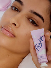 Load image into Gallery viewer, Model holding up Lanolips 12 Hour Overnight Lip Mask
