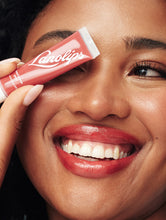 Load image into Gallery viewer, Model wearing Lanolips Tinted Lip Balm SPF30 in Red Apple 
