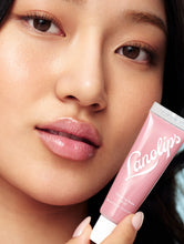 Load image into Gallery viewer, Model wearing Lanolips Tinted Lip Balm SPF 30 in Rose
