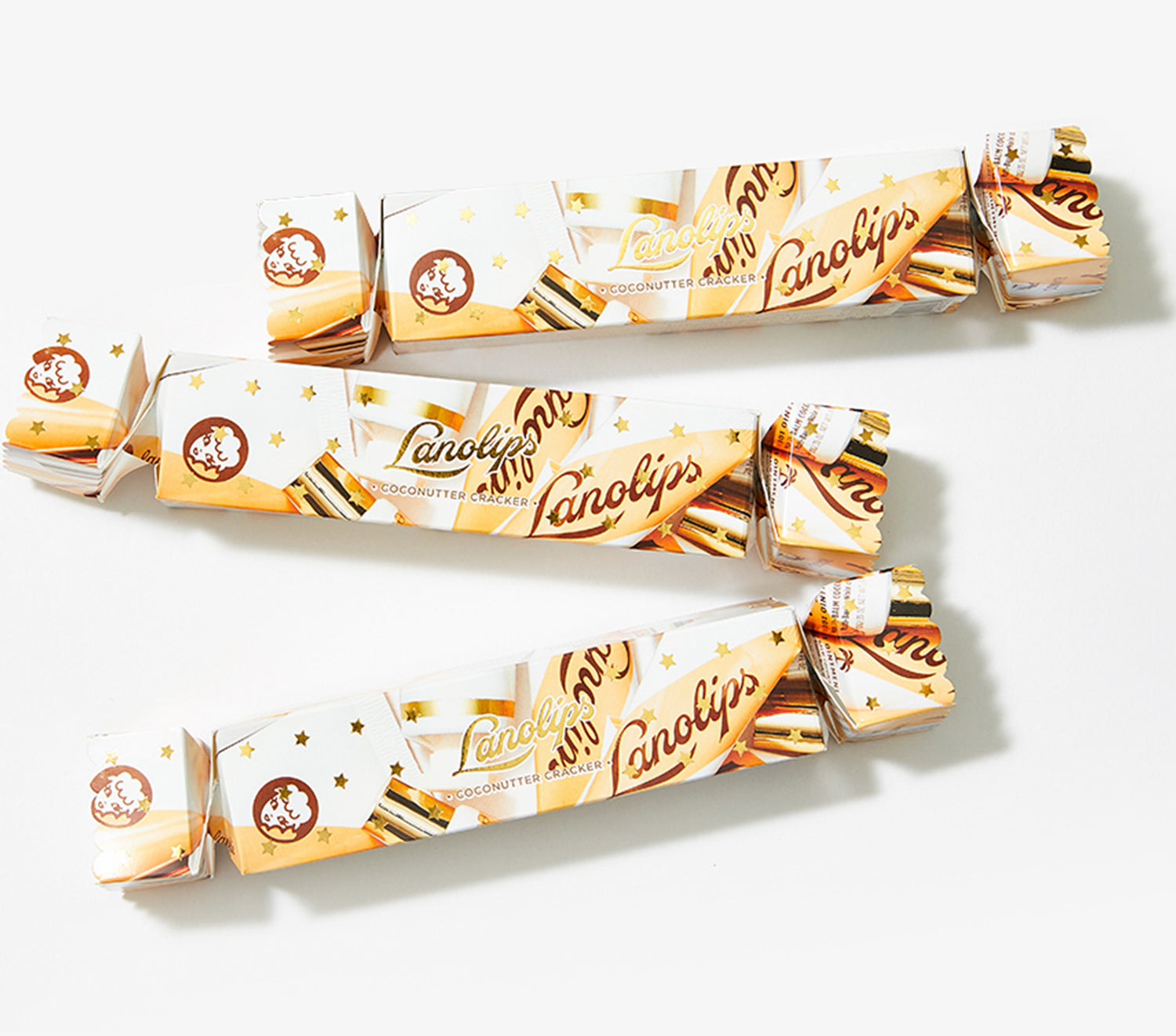 Multiple Lanolips Limited Edition Coconutter Crackers laid on a white background. 
