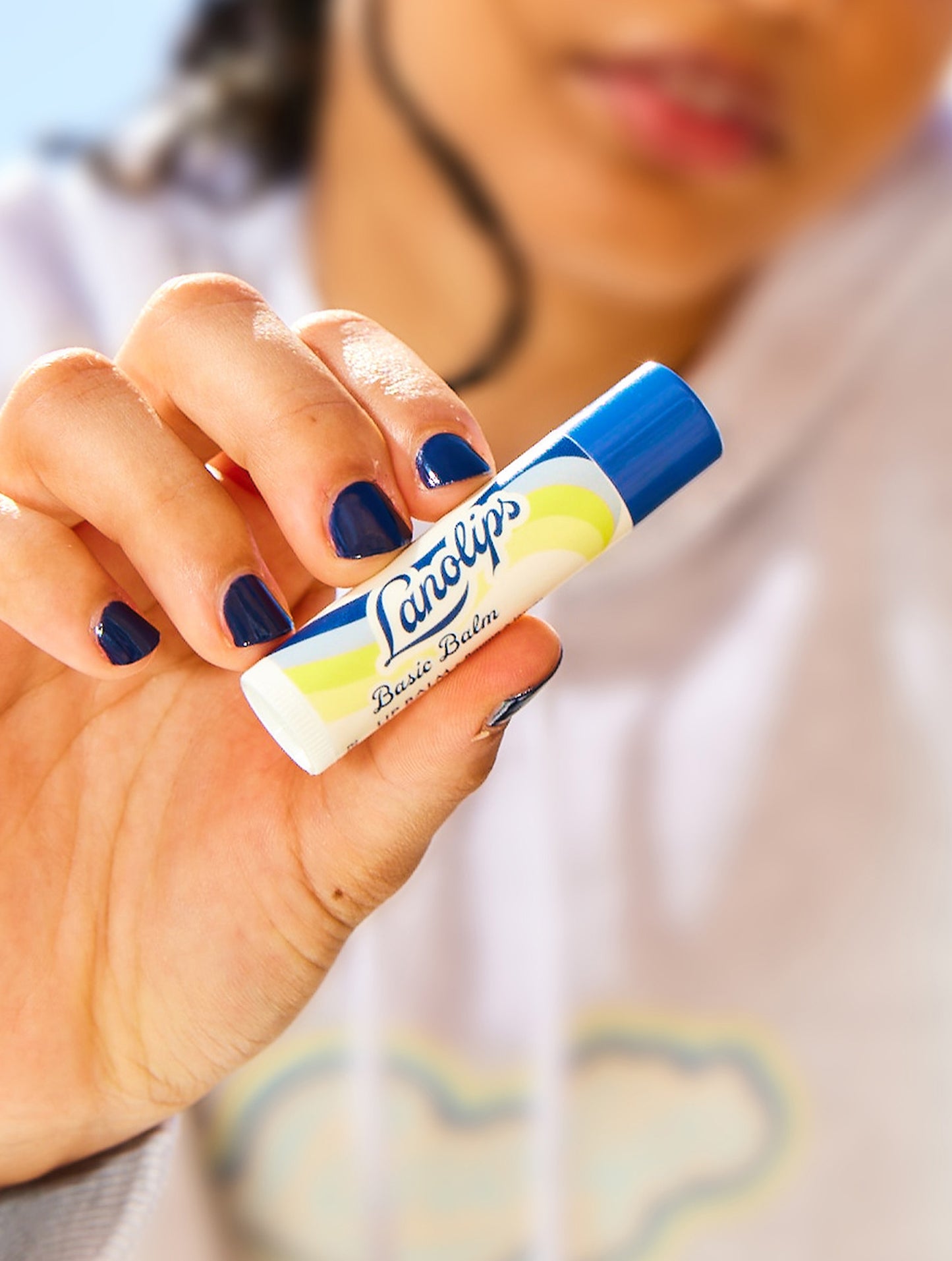 Lifestyle shot of the Lanolips Basic Balm Original Vanilla.