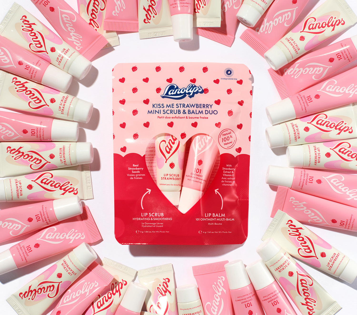 Lifestyle shot of the Lanolips Kiss Me Strawberry Mini Scrub & Balm Duo in Strawberry. Contains our bestselling 101 Ointment Multi Balm Strawberry and Lip Scrub Strawberry. 