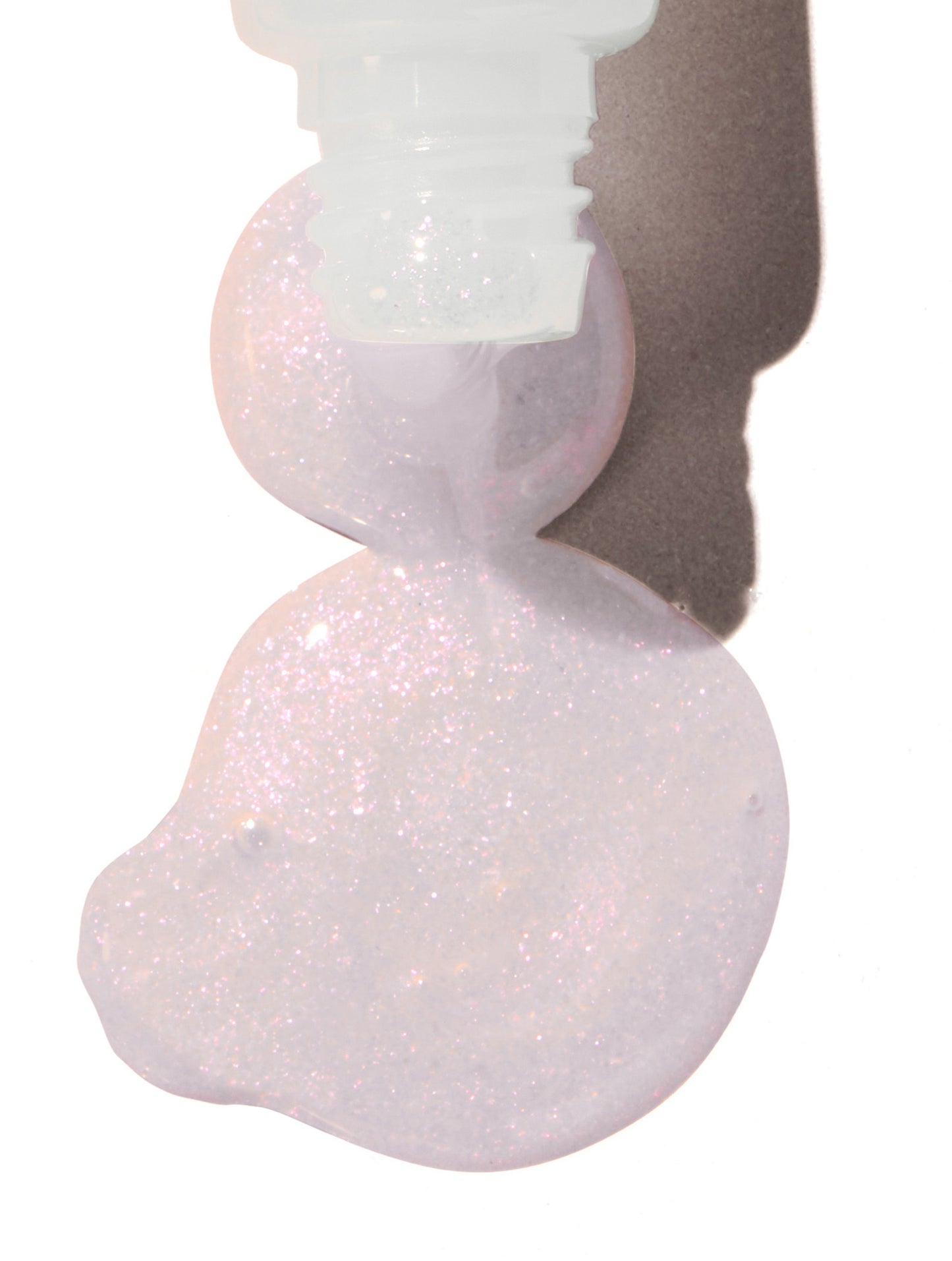 Product shot of Lanolips Liquid Lip Water Original, showing the colour, finish and texture of the product.