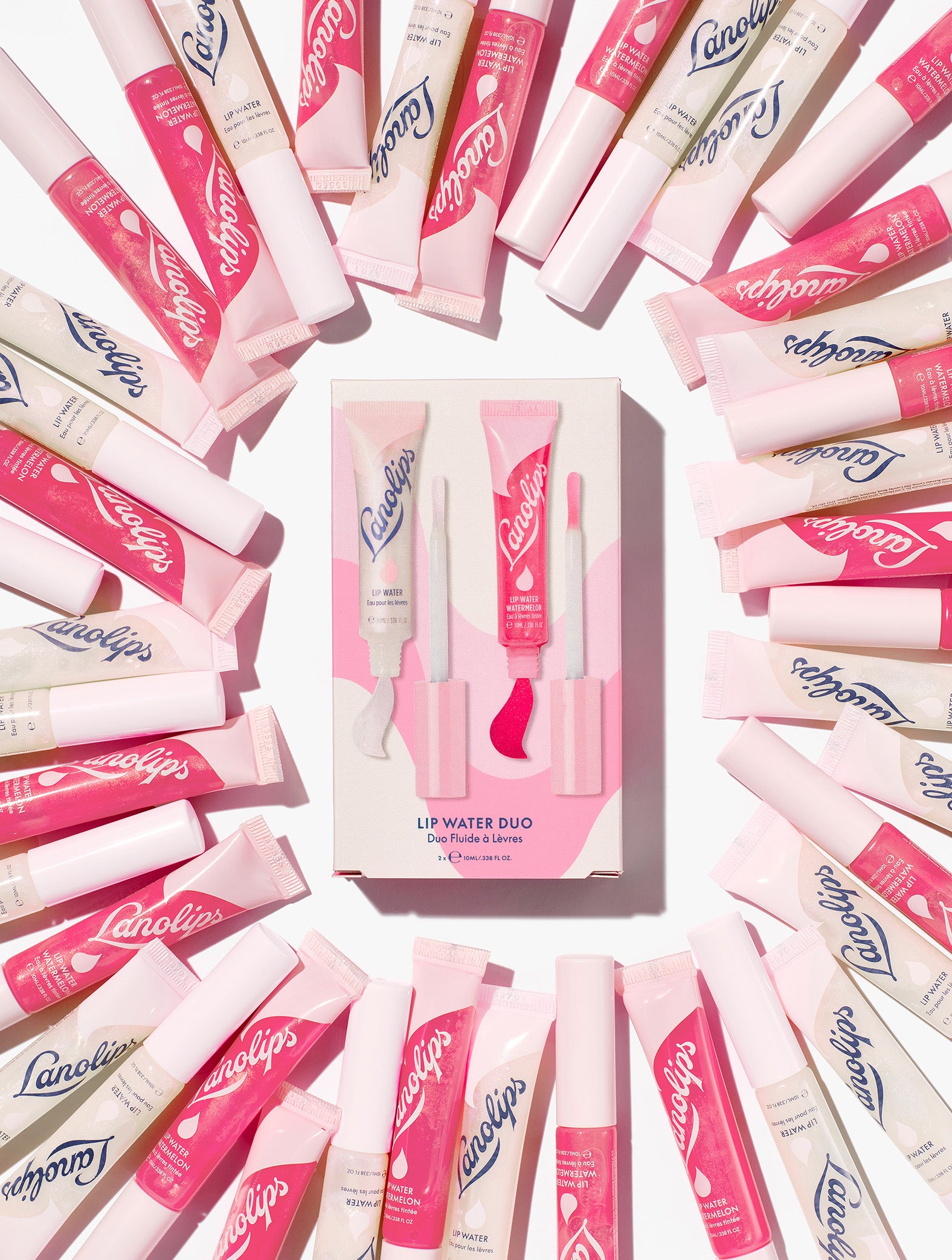 Still shot of Lanolips Lanolin Lip Water Duo surrounded by tubes of Liquid Lanolin Lip Water and Lip Water Watermelon. Fantastic for the gift giving season. 