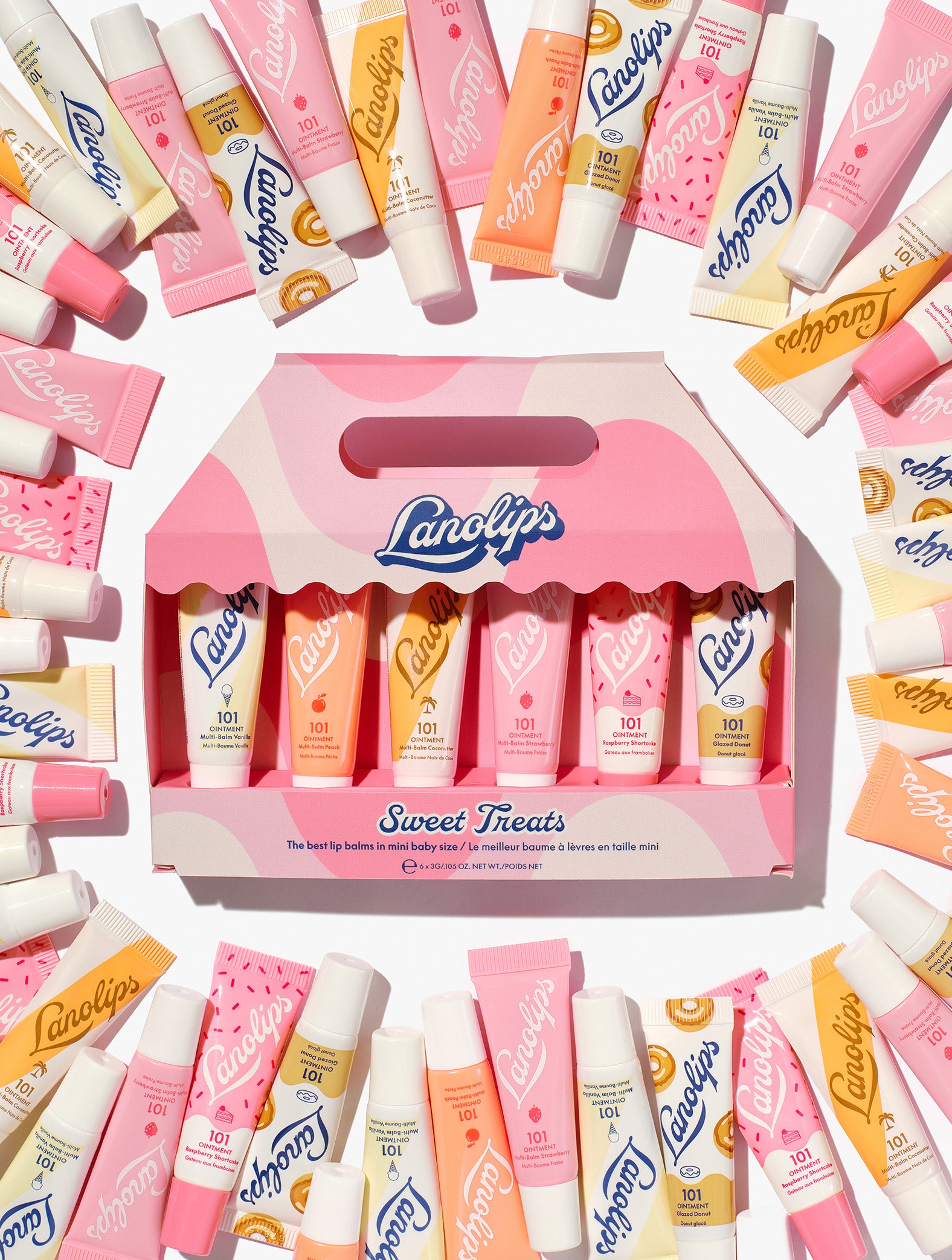 Lanolips Sweet Treats gift set – 6 pc mini 101 Ointment balms in assorted flavours, packed in a pink carry box surrounded by colourful Lanolips tubes.