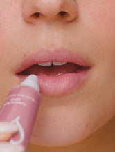 Load and play video in Gallery viewer, Video of applying and holding the Lanolips Tinted Lip Balm SPF30 in Perfect Nude
