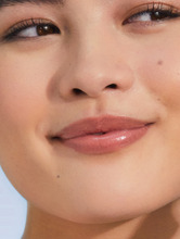 Load image into Gallery viewer, Model with Tinted Lip Balm in Perfect Nude SPF30 is anchored by the high lanolin content, drenching the lips in non-sticky hydration which lasts for hours with the perfect nude tint which suits everyone.
