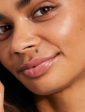Load image into Gallery viewer, Model wearing the Tinted Lip Balm in Perfect Nude. It’s the cult all-in-one tinted balm you’ve been waiting for.
