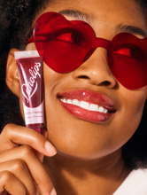 Load image into Gallery viewer, Model wearing Lanolips&#39; Glossy Balm Berry. 
