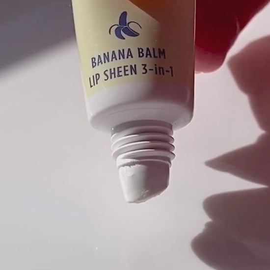Video of Lanolips Banana Balm Lip Sheen 3-in-1 being squeezed from the tube