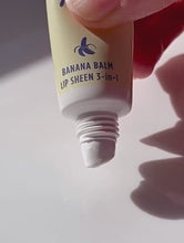 Load and play video in Gallery viewer, Video of Lanolips Banana Balm Lip Sheen 3-in-1 being squeezed from the tube
