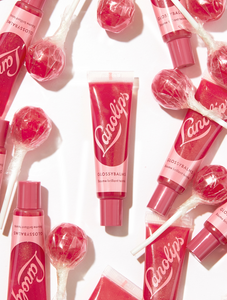 Lanolips' Glossy Balm Candy a fruity pink tint with added gold flecks for the ultimate glossy tint  