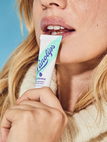 Model holding a 101 Ointment Multi-Balm Minty