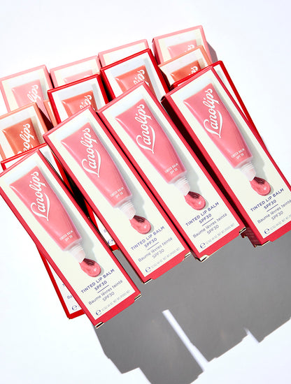 Boxes of the Lanolips Tinted Lip Balm SPF30 range